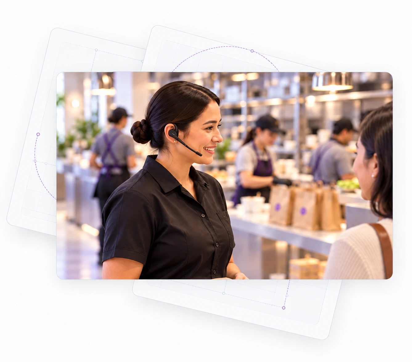 A manager wearing a headset remains engaged with a customer; restaurant operating context supports the next action.