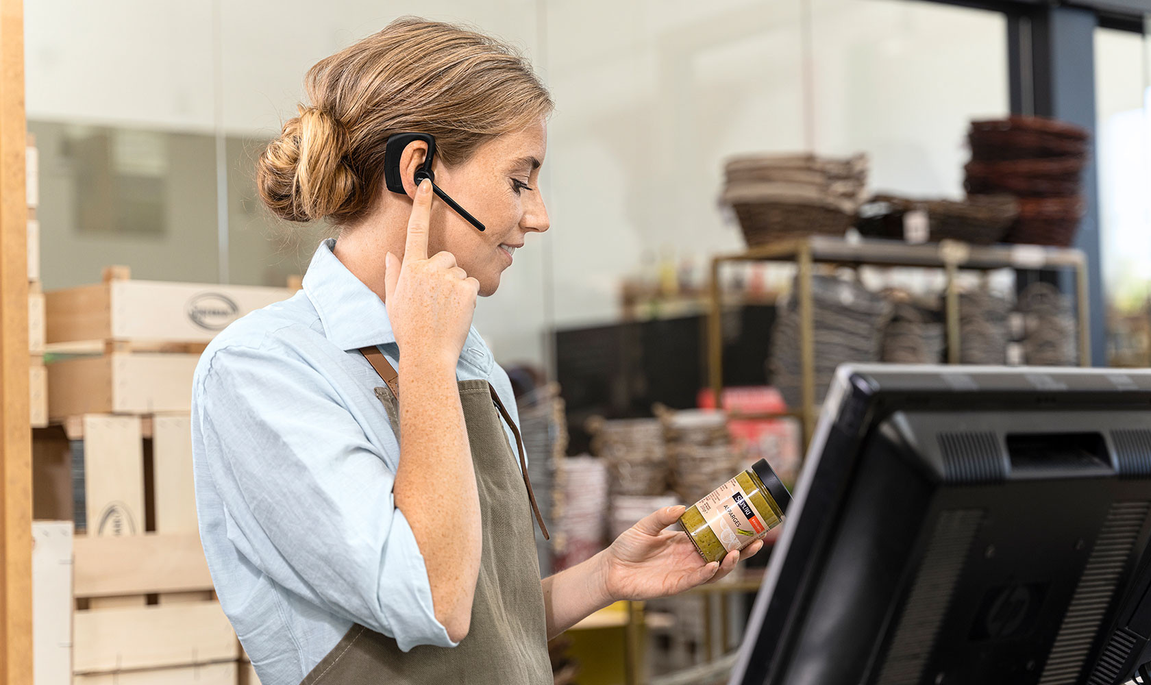 Manager using a Jabra headset while working hands-free